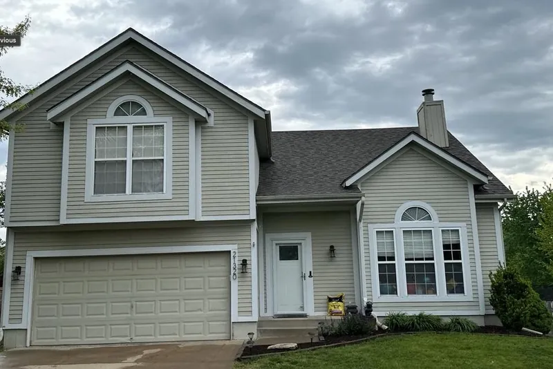 Two-story home with professional roof installation